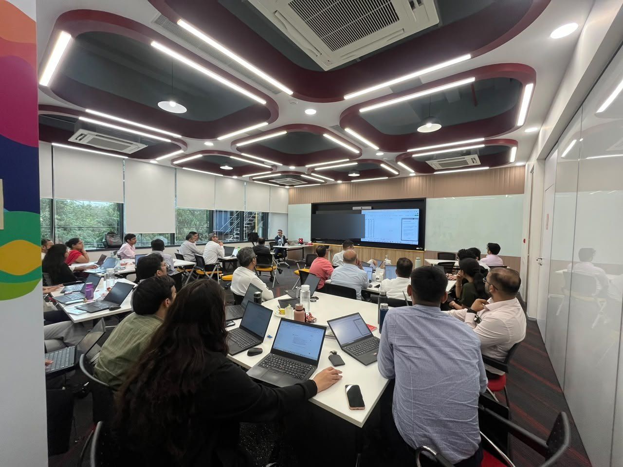 Participants working on laptops during a hands-on exercise